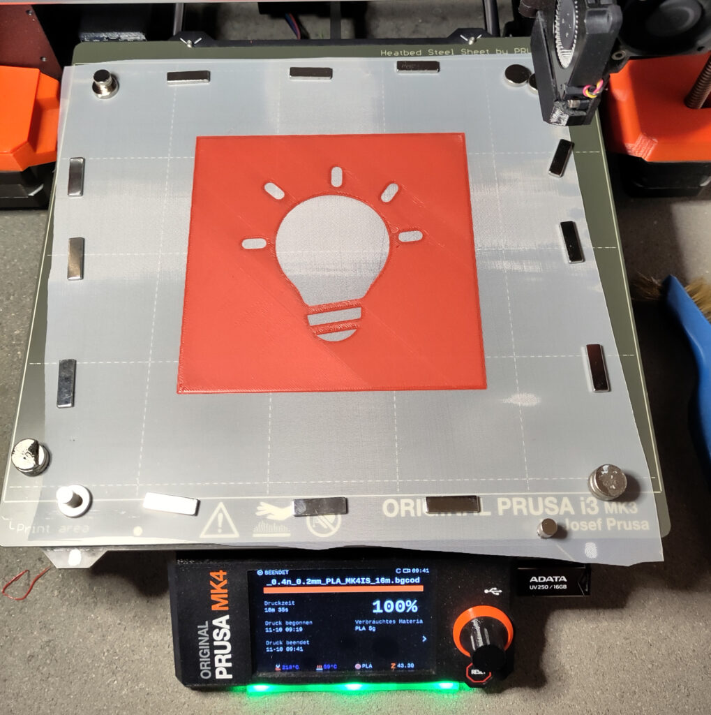 3D-printed stencil of an lightbulb on silk screen